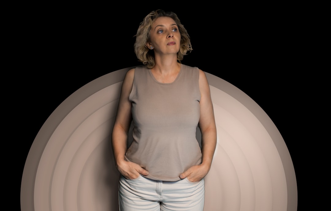 A woman looking thoughtful and composed, representing bladder health challenges