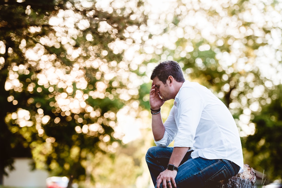 A middle-aged man with a contemplative expression, reflecting emotional and intimacy concerns