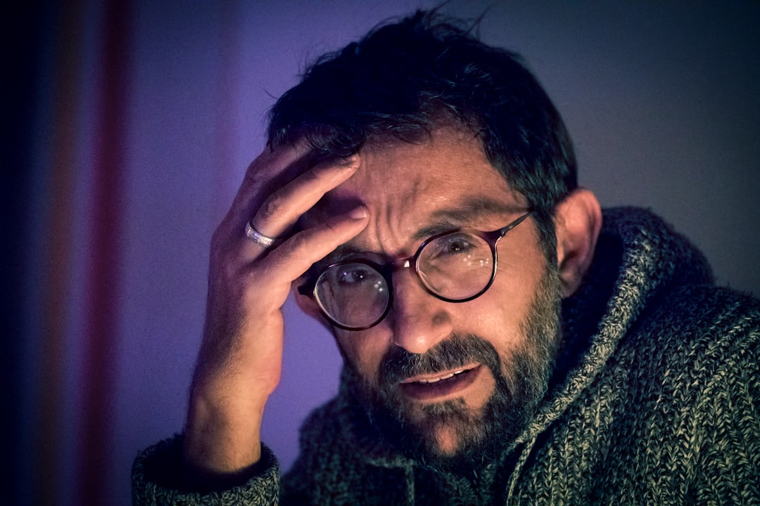 A middle-aged man with a contemplative expression, reflecting emotional and intimacy concerns